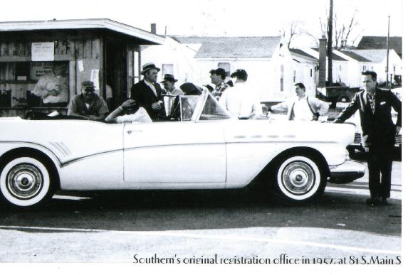 Photo, Larry Tribble Sr, standing behind auto, 1957, Southern Auto Auction at first site, 81 So. Main St., Warehouse Point.