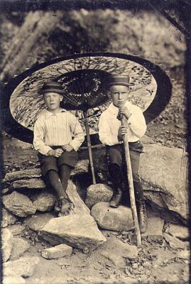 Two Unidentified Boys with Umbrella