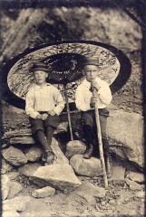 Two Unidentified Boys with Umbrella