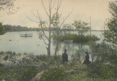 Portrait of Two Women Sitting Near a Lake