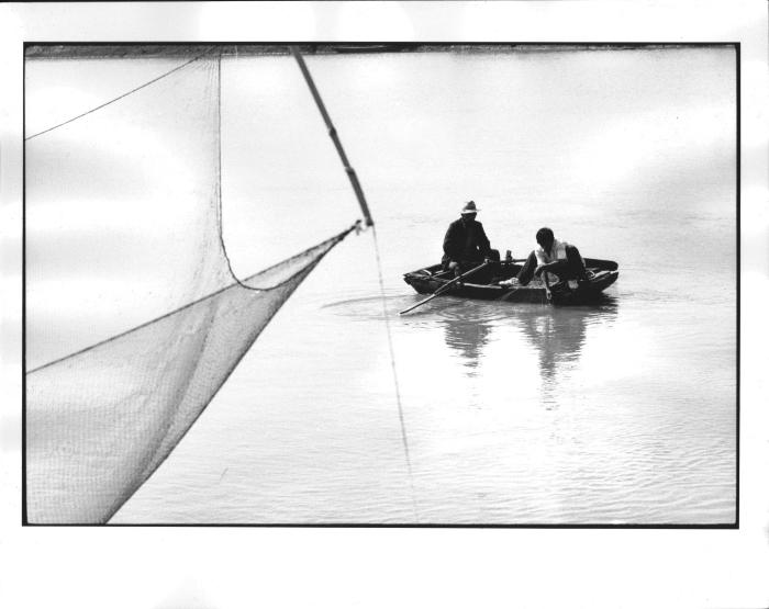 [Men in a rowboat with fishing net], Jiangsu Province, China