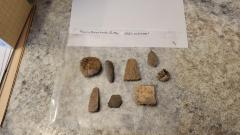 (8) Arrowheads, Possible coin or button, rocks