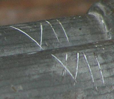 Detail of Roman numerals (a - back, b-front)