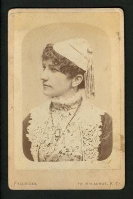 Photograph: Portrait of Linda Jeal, circus equestrienne, in white tasseled cap, 1884