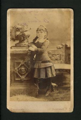 Photograph: Portrait of circus equestrienne Nellie Ryland, as a child, 1884