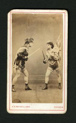 Photograph: Portrait of couple sword fighting