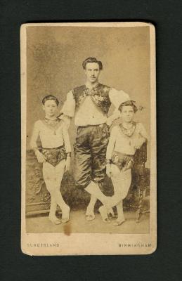 Photograph: Portrait of father and two boys in costume
