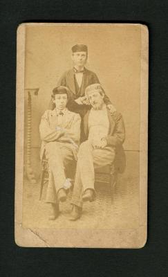 Photograph: Portrait of three men wearing smoking caps
