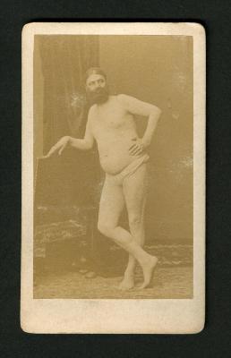 Photograph: Portrait of Capt. George Costentenus wearing only loincloth