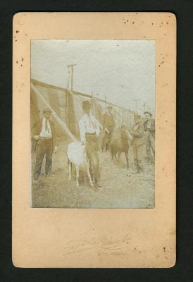 Photograph: Men, boys and 2 ponies at Elks Carnival, 1902