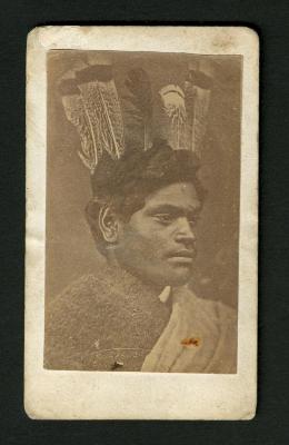 Photograph: Portrait bust of man with feathers in hair