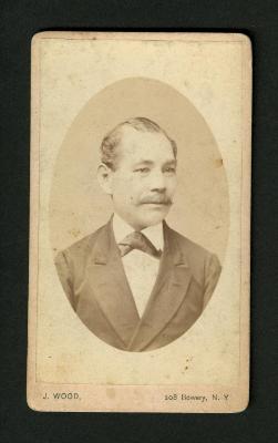 Photograph: Portrait bust of man with mustache, bow tie