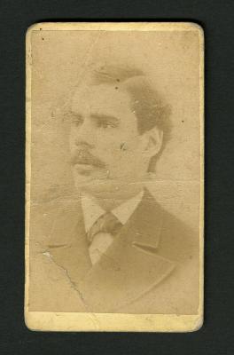 Photograph: Portrait bust of man in jacket with wide lapels