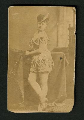 Photograph: Portrait of female performer in sleeveless costume with shorts and boots