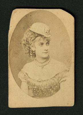 Photograph: Portrait of woman wearing bowler-style hat with sheriff's star 