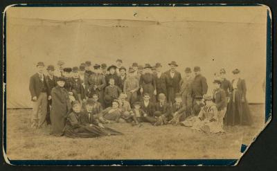 Photograph: Group of men and women outside circus tent