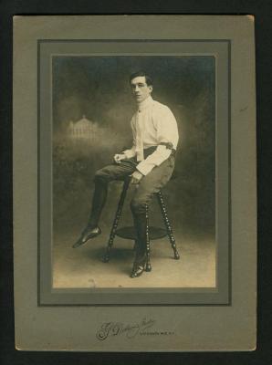 Photograph: Eddie F. Smith in performance clothing sitting on stool