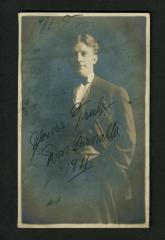 Postcard: Don G. Cornalla, 3/4 length standing with hand in pocket
