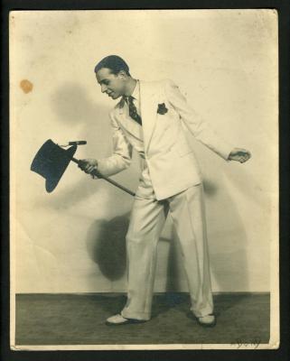 Photograph: Don G. Cornalla balancing top hat and cigar on cane