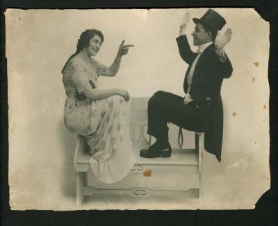 Photograph: Hamlin and Mack, sitting on the arms of a bench