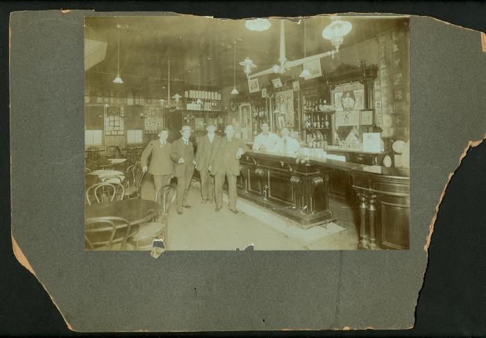 Photograph: Interior of bar including poster for 20th Century Maids