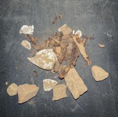 mix of shells, metal, and brick