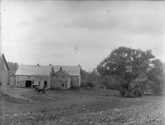 Yard and outbuildings of unidentified house